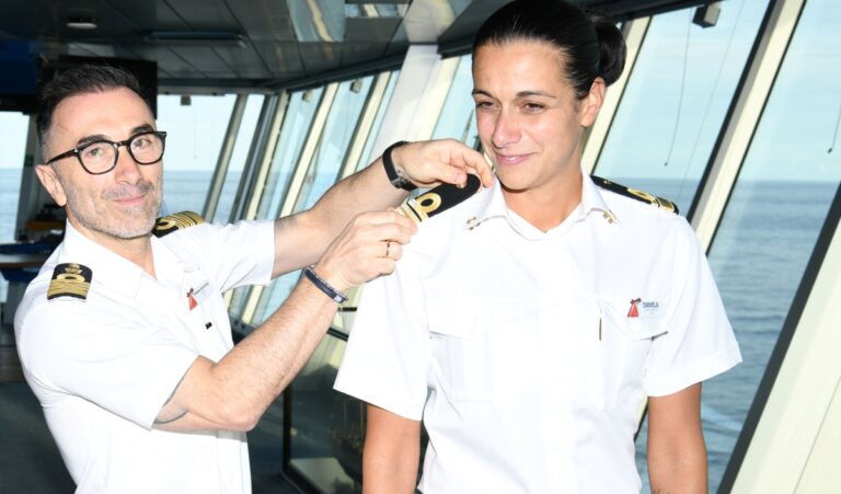 Captain Francesco Bencivenga places the epaulettes on Daniela Gargiulo_mid